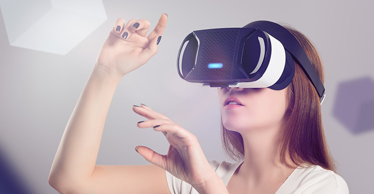 woman wearing VR headset and tapping in the air